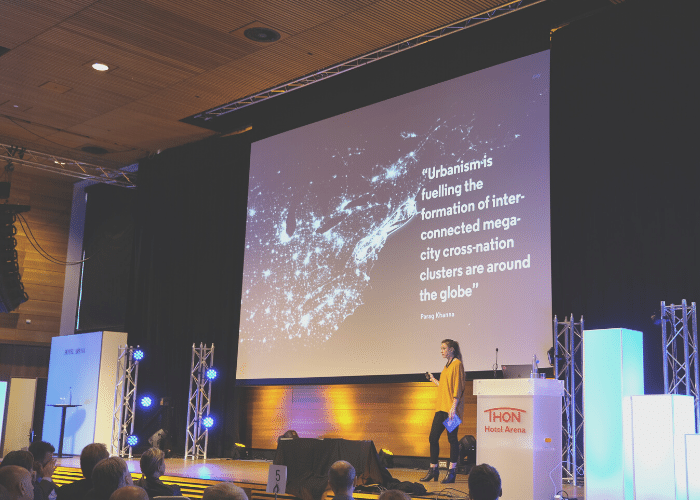 Courtney McConnochie presenting on The Future of Cities in Oslo