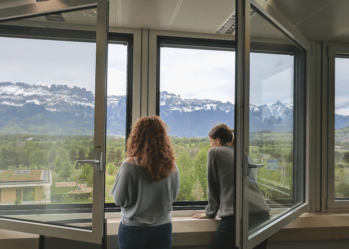 Courtney McConnochie - office with a view of mountains in Switzerland