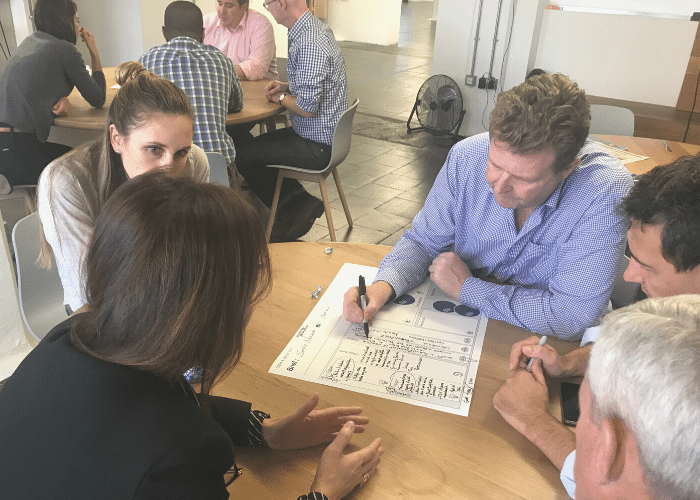 Courtney McConnochie working with internal group